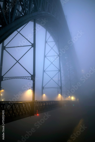 Dom Luis I Iron Bridge at night in thick milky fog, Porto, Portugal.
