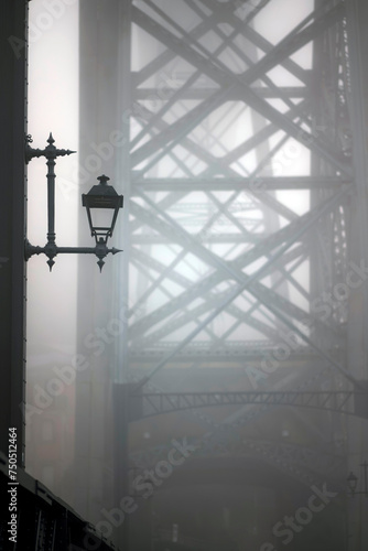 A fragment of the Dom Luis I Iron Bridge in thick fog, Porto, Portugal.