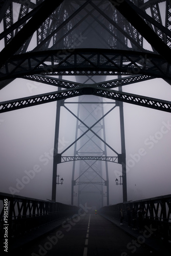 Lower level of the Dom Luis I Bridge at night in thick fog, Porto, Portugal.