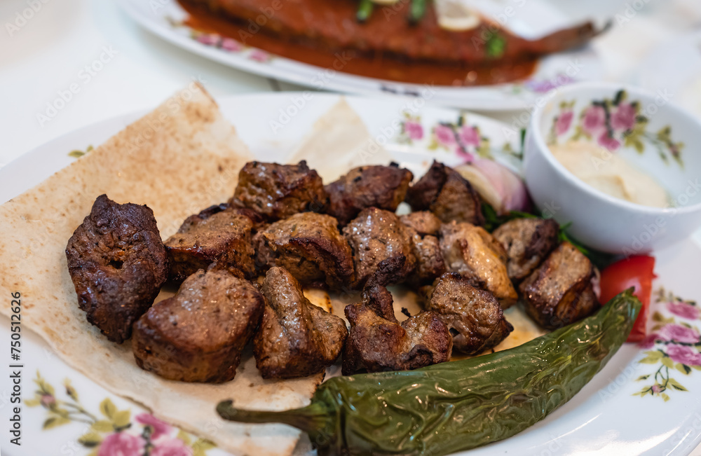 Grilled meat and vegetables. Turkish and Arabic Traditional Kebab Plate Lamb, Beef on bread