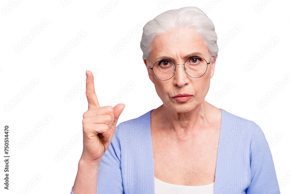 Portrait of grey haired old strict woman wearing glasses pointing up threatening with finger. Isolated over violet purple background Portrait of grey haired old strict woman wearing glasses pointing up threatening with finger. Isolated over violet purple background