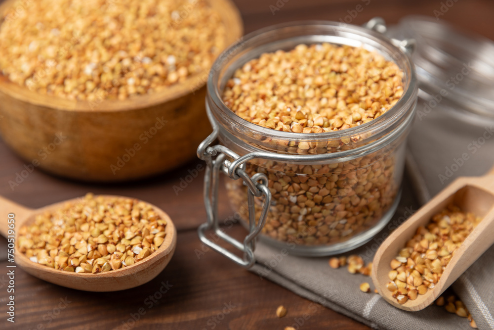 Green buckwheat in a bowl on a wooden kitchen table.Superfood.Raw buckwheat porridge.Healthy vegan food concept, eco products, diet. Copy space.Organic food.weight loss and proper nutrition. Green buckwheat in a bowl on a wooden kitchen table.Superfood.Raw buckwheat porridge.Healthy vegan food concept, eco products, diet. Copy space.Organic food.weight loss and proper nutrition.