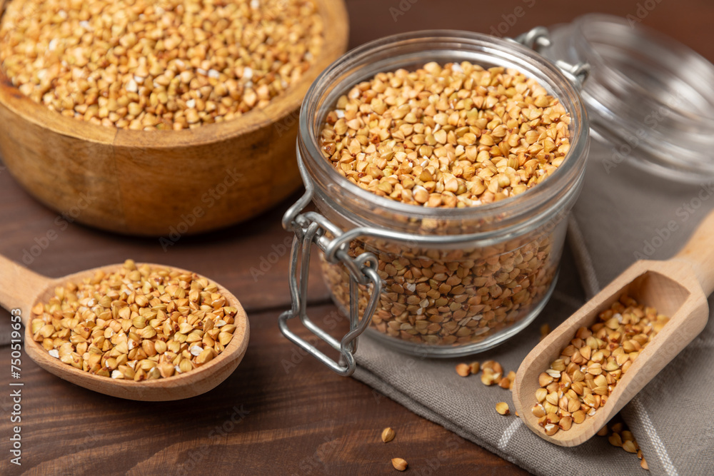 Green buckwheat in a bowl on a wooden kitchen table.Superfood.Raw buckwheat porridge.Healthy vegan food concept, eco products, diet. Copy space.Organic food.weight loss and proper nutrition. Green buckwheat in a bowl on a wooden kitchen table.Superfood.Raw buckwheat porridge.Healthy vegan food concept, eco products, diet. Copy space.Organic food.weight loss and proper nutrition.