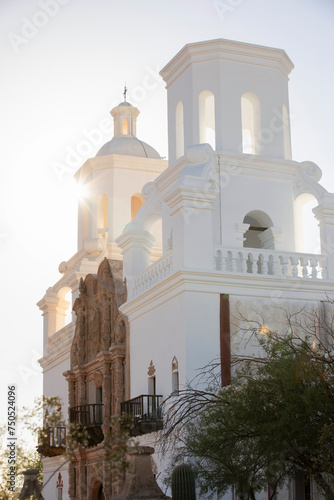 Built in 1797, afternoon light shines on the historic Spanish colonial era San Xavier del Bac Mission in Tucson, Arizona, USA.