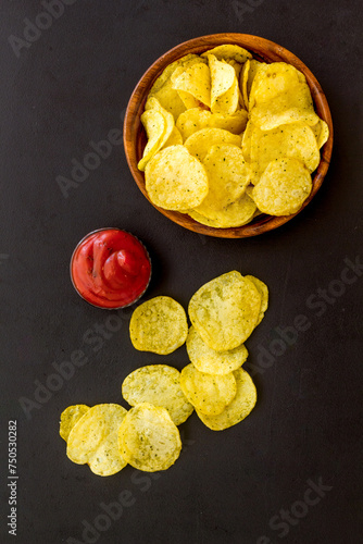 Oven backed low calorie potato chips. Snacks background, top view