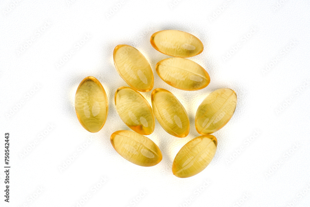 Golden color oil supplements isolated on white background Golden color oil supplements isolated on white background
