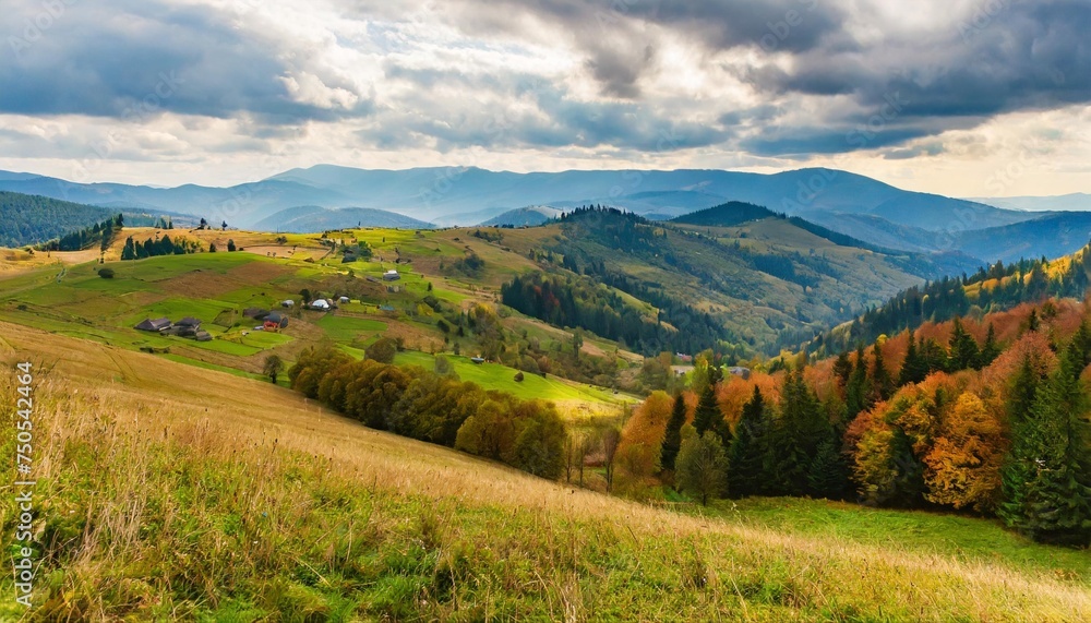 rolling hills of mountainous countryside landscape scenery of carpathian rural area in autumn season on an overcast day village in the valley