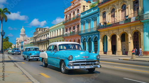 Vintage American Cars on Colorful Havana Street with Classic Colonial Architecture and Palm Trees in Sunny Cuba © Marina