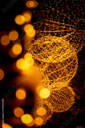 A beautiful winter scenery of led iluminated trees in the town streets in Latvia. Festive winter decorations in Northern Europe.