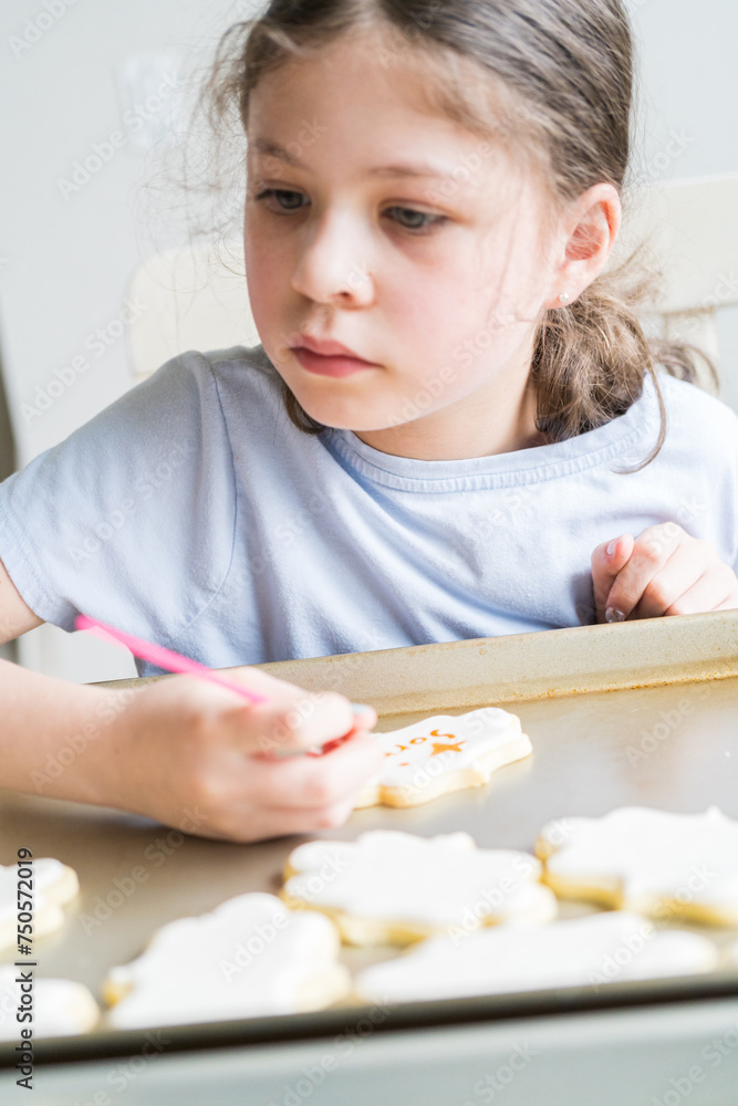 Little Girl Spells 'Sorry' on Iced Sugar Cookies Little Girl Spells 'Sorry' on Iced Sugar Cookies