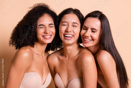Photo of sweet funny women wear lingerie no retouch skin closed eyes laughing isolated pastel beige color background