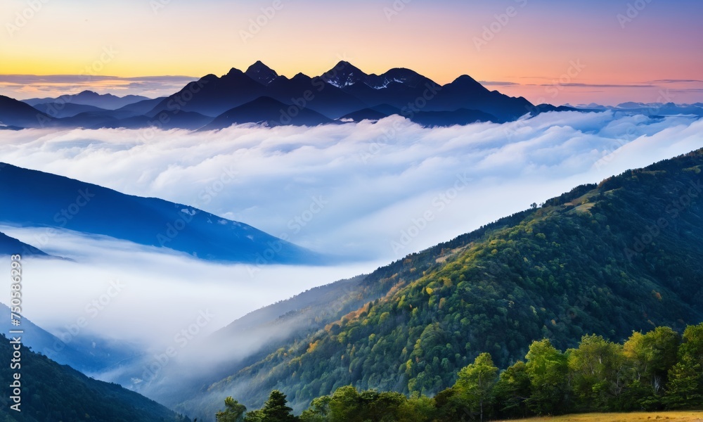a mountain range covered in clouds and trees at sunset with a colorful sky