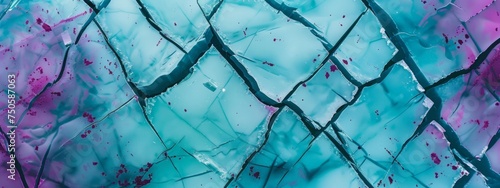 abstract pattern that resembles ariel view of cracked ice, cracks have teal and magenta colors photo