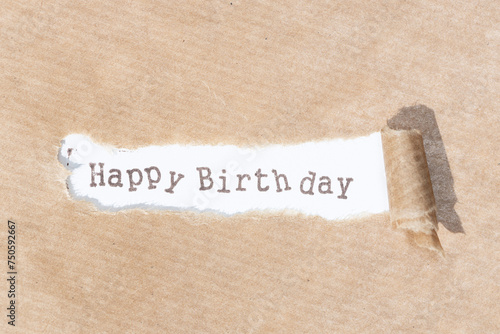 Happy Birthday message. Brown paper torn stripe with text on white paper background