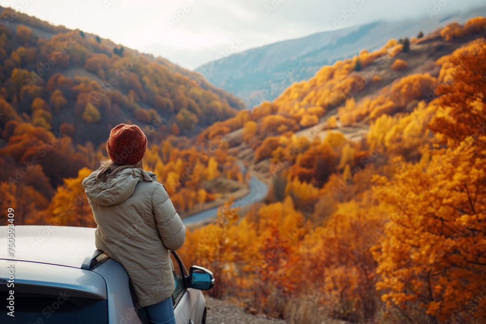 Fototapeta premium solo traveler from the Asia Pacific region pauses to capture the moment in autumn season