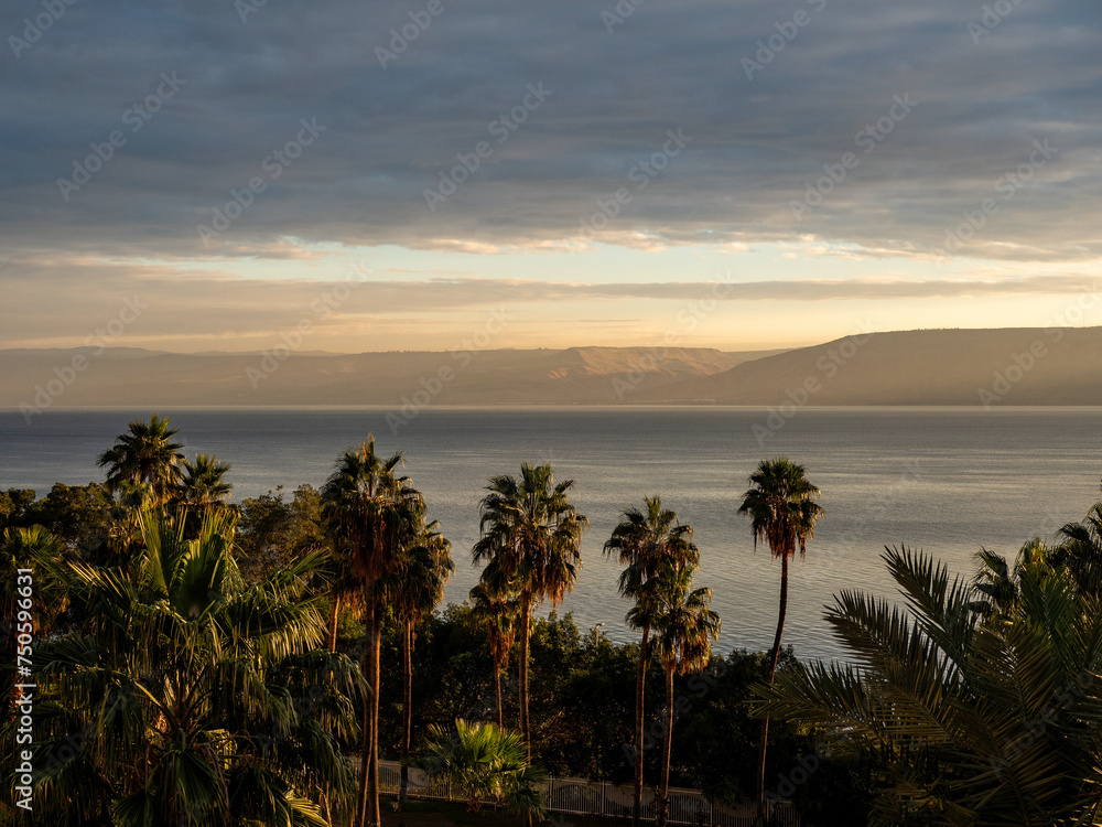 sunset on the beach, View of the sea of Galilee (Kineret lake), Israel .