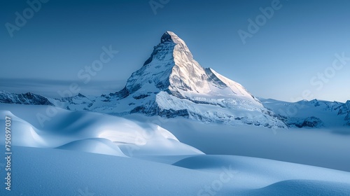 Majestic Snow-Capped Mountain Peak Towering Above Pristine Winter Landscape Under Serene Blue Sky