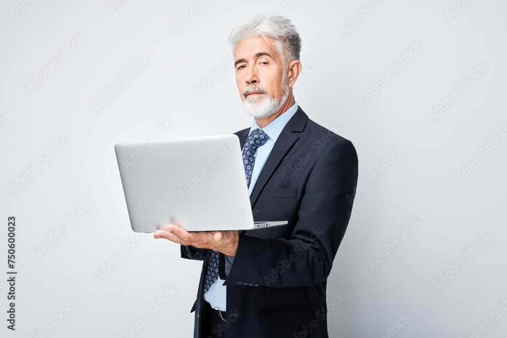 Senior businessman using laptop on white background. Senior businessman using laptop on white background.