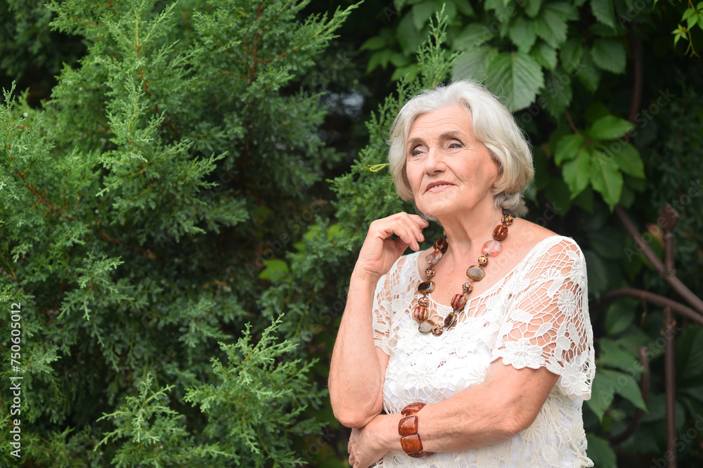 Portrait of happy senior woman posing at forest Portrait of happy senior woman posing at forest