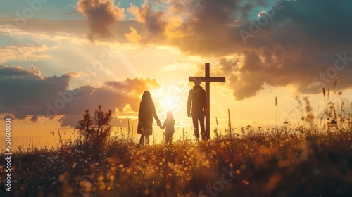 A family stands in front of the cross, a family looks for the silhouette of the cross of Jesus Christ. The concept of Easter. photo