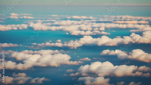 Mesmerizing expanse above clouds, daytime's canvas painted in shades of blue. Beautiful nature concept. Cinematic footage. Time-lapse. Summer sky background. 4K UHD.
