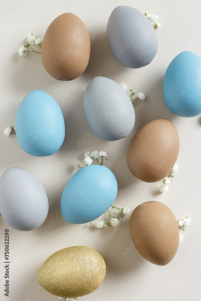 Easter Eggs pattern with White Gypsophila flowers on Light beige Background. Dyed colorful eggs in pastel colors, spring holiday photo, tender soft hues, flatly of celebration food and white blooms Easter Eggs pattern with White Gypsophila flowers on Light beige Background. Dyed colorful eggs in pastel colors, spring holiday photo, tender soft hues, flatly of celebration food and white blooms