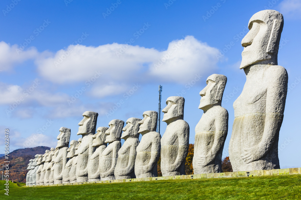 Sky's Ancient Sculpture of Stone head: Buddha Monument at Hill of Budha, Sapporo, Hokkaido, Japan