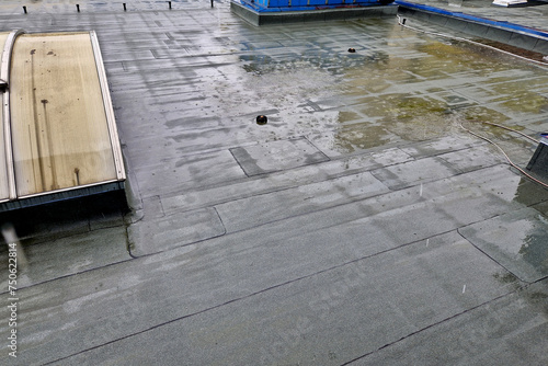 asphalt foil roof insulation is best tested by flooding it with water. rainwater drainage channels must work. regularly check clogged dirt grids.