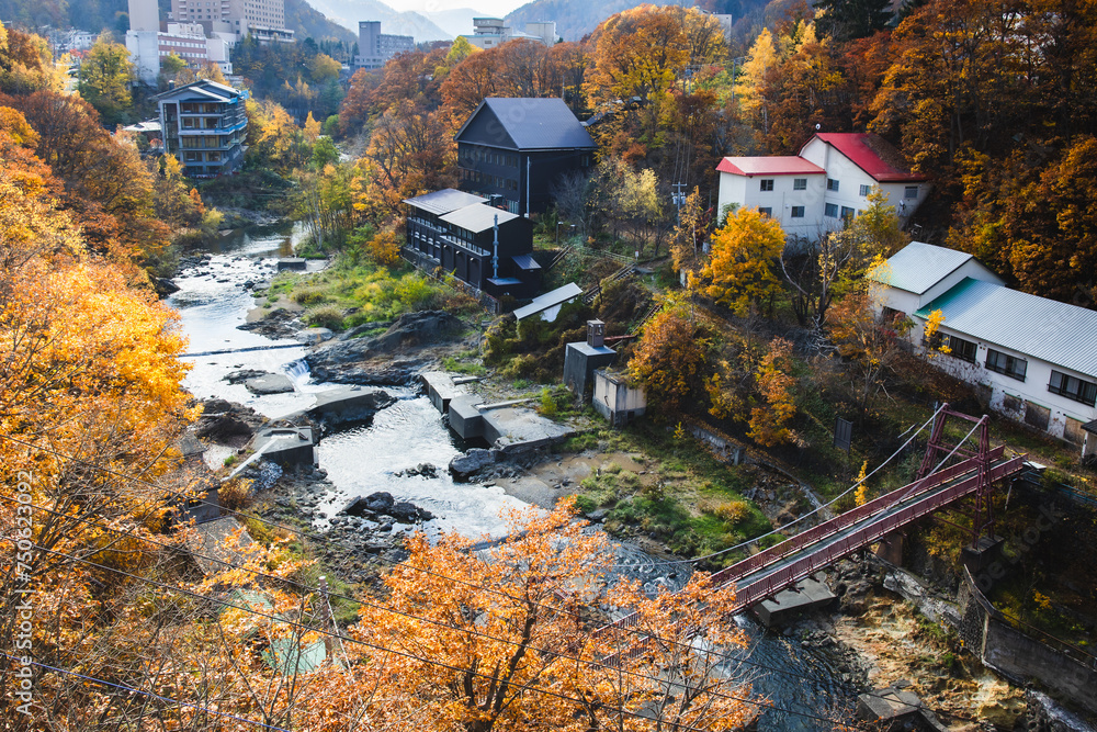 Sapporo, Hokkaido, Japan - November 2023 : Autumn scenery of Jozankei Onsen Resort, a famous hot spring destination with the hotels and traditional Ryokan surrounded by fall colors.
