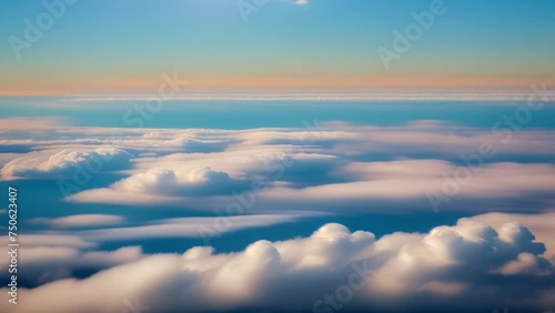 Tranquil blue sky draped with cotton candy clouds, a serene canvas from above. Atmosphere concept. Nature stock footage. Timelapse. Cloud background. 4K HDR.
