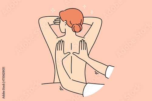 Woman attends massage treatments in SPA salon, lying with bare back and enjoying rejuvenation therapy. Hands of massage specialist kneading skin of relaxed girl, is tired after difficult work week