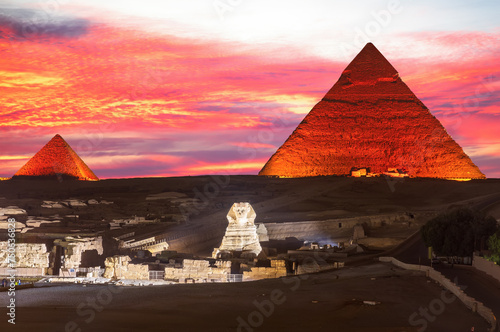 Illuminated Pyramids of Egypt and the great Sphinx night view, Giza