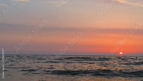 FHD Video of Orange Sunset over a Slightly Rippling Sea