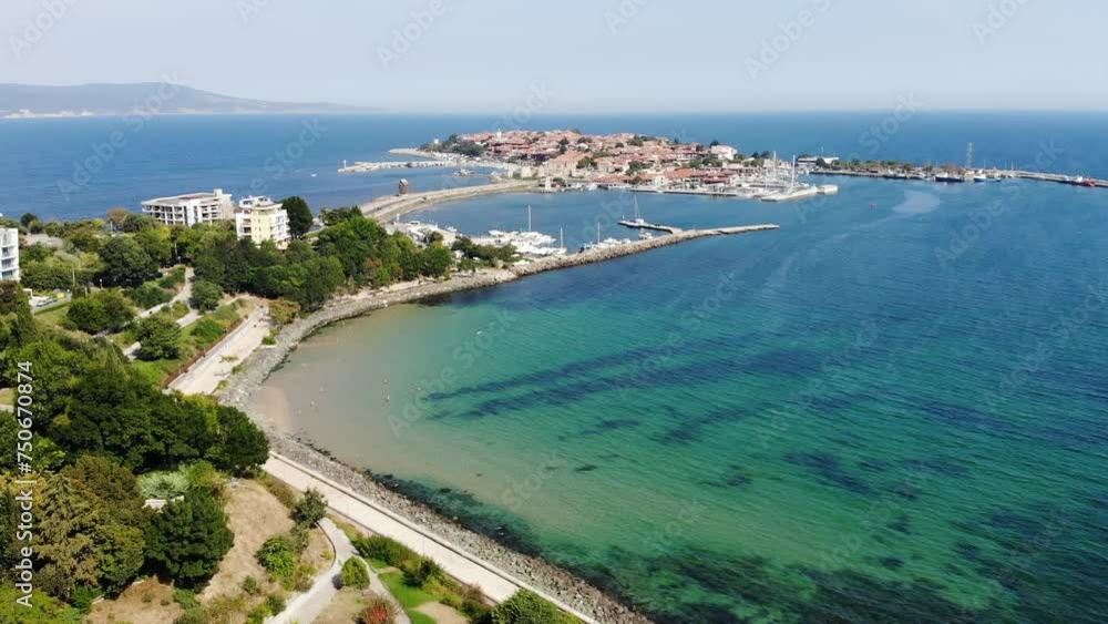 Aerial view of beaches of Nessebar, houses, hotels and sunbeds. Drone view from above. Summer holidays destination. Aerial view of beaches of Nessebar, houses, hotels and sunbeds. Drone view from above. Summer holidays destination.