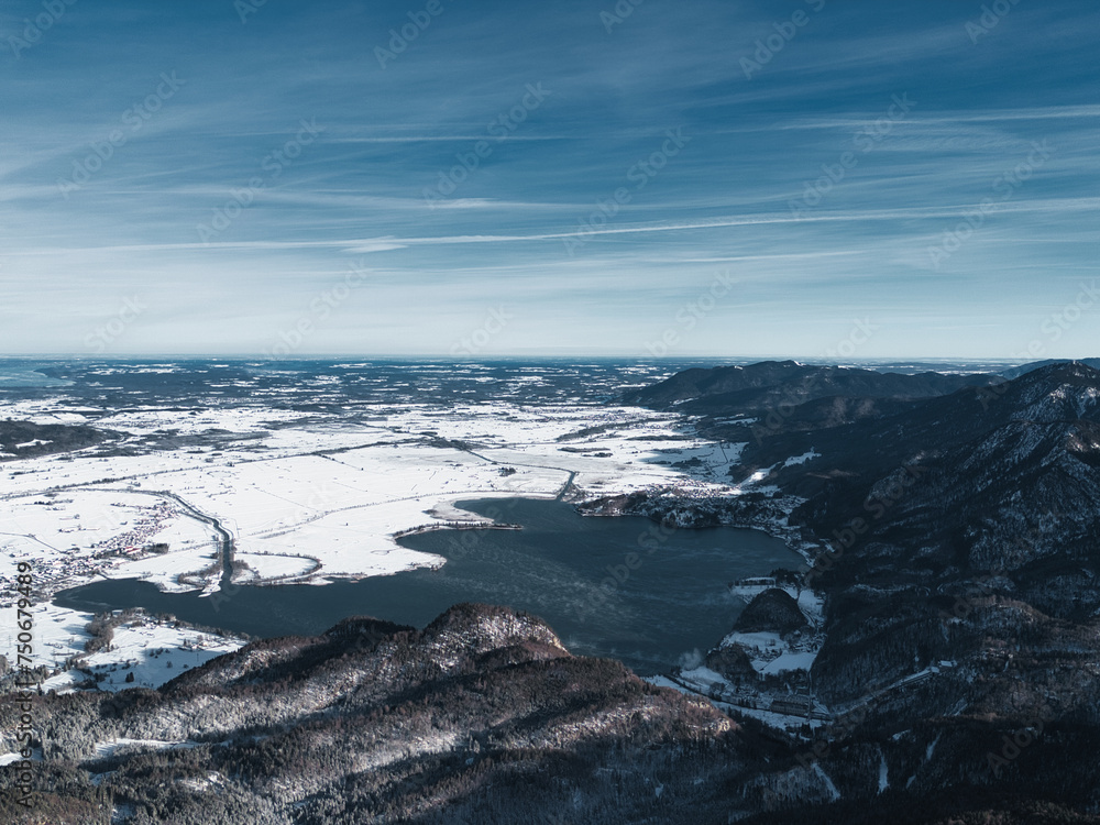 Drone shots at Herzogstand in Bavaria near the Alps, with snow-covered mountains, lakes and landscapes in the background Drone shots at Herzogstand in Bavaria near the Alps, with snow-covered mountains, lakes and landscapes in the background