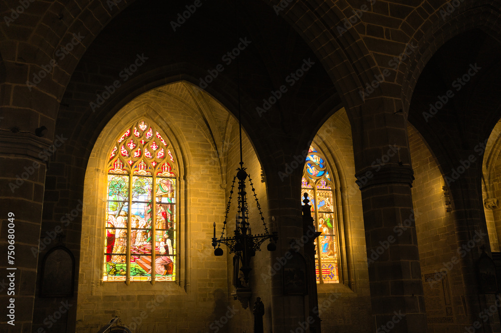Tained window and interior of medieval gothic church of Vitre, Bretagne, France
