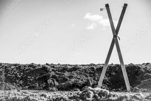 Selective focus on survey stake and flag at a construction site