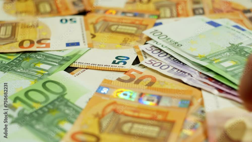 Euro banknotes are spread out on the table, an element of business processes. This reflects not only material success, but also influence at the international level in the economy. Euro banknotes are spread out on the table, an element of business processes. This reflects not only material success, but also influence at the international level in the economy.
