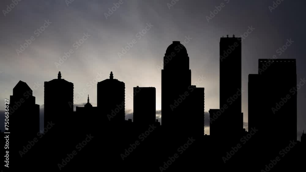 Kentucky: Louisville downtown skyline at Sunrise, Time Lapse with Fast Clouds and Dark Silhouette of Skyscrapers Kentucky: Louisville downtown skyline at Sunrise, Time Lapse with Fast Clouds and Dark Silhouette of Skyscrapers