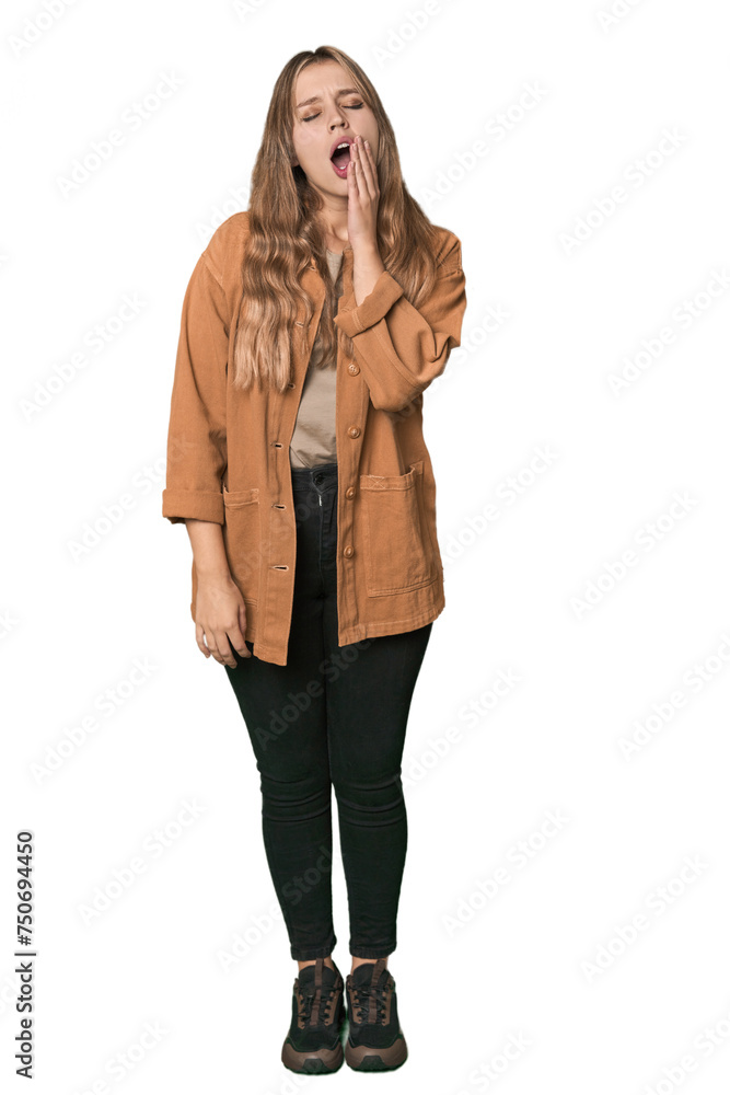 Studio portrait of a blonde Caucasian woman yawning showing a tired gesture covering mouth with hand. Studio portrait of a blonde Caucasian woman yawning showing a tired gesture covering mouth with hand.