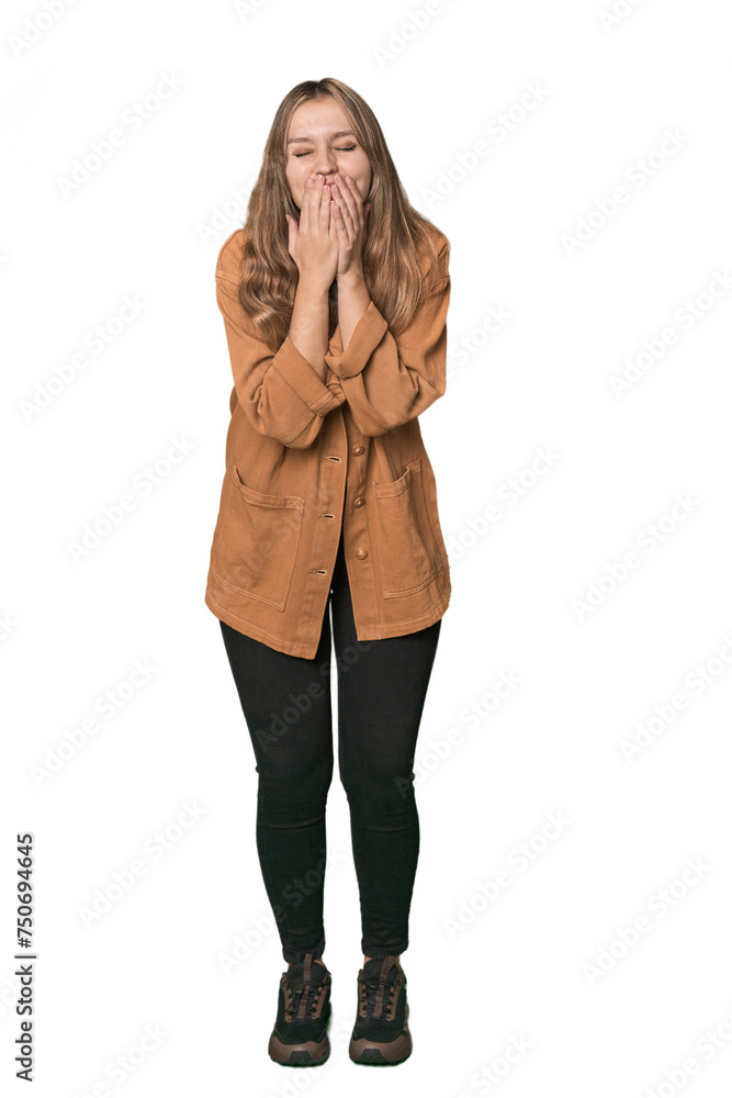 Studio portrait of a blonde Caucasian woman laughing about something, covering mouth with hands. Studio portrait of a blonde Caucasian woman laughing about something, covering mouth with hands.