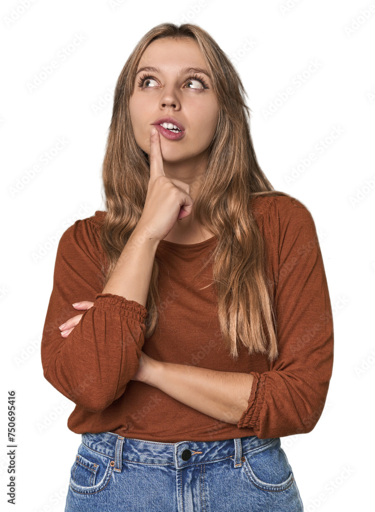 Studio portrait of a blonde Caucasian woman looking sideways with doubtful and skeptical expression. Studio portrait of a blonde Caucasian woman looking sideways with doubtful and skeptical expression.