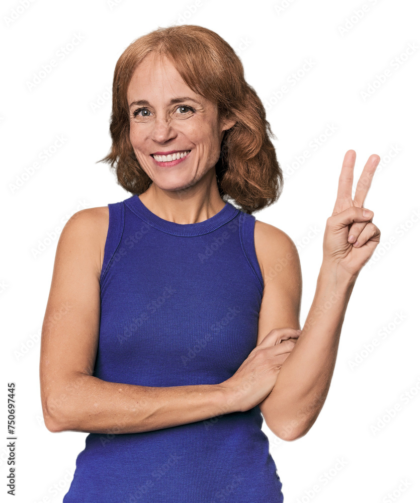 Redhead mid-aged Caucasian woman in studio showing number two with fingers. Redhead mid-aged Caucasian woman in studio showing number two with fingers.
