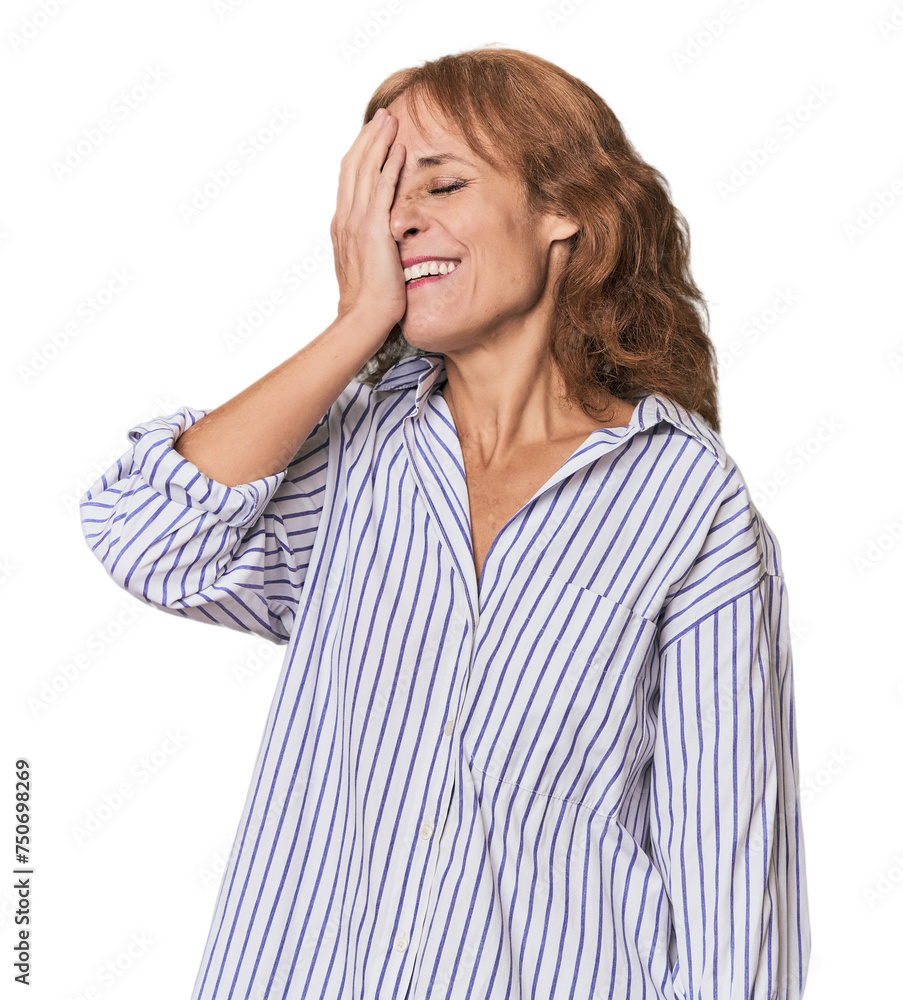 Redhead mid-aged Caucasian woman in studio laughing happy, carefree, natural emotion. Redhead mid-aged Caucasian woman in studio laughing happy, carefree, natural emotion.