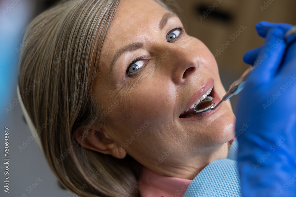 Woman sitting in dental chair teeth treatment Woman sitting in dental chair teeth treatment