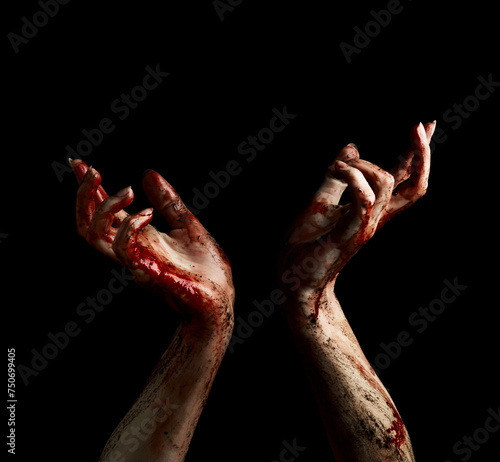 Creepy hands of undead with dripping blood over black background