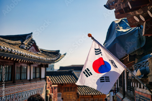 SEOUL, SOUTH KOREA - MARCH 01, 2024 : Unidentified tourists are traveling to traditional Korean style architecture at Bukchon Hanok Village in Seoul, South Korea. photo