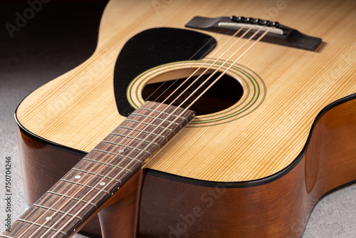 Classical guitar close up. Acoustic guitar on wood background.Music instrument concept