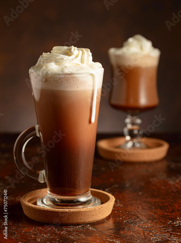 Creamy milk chocolate drinks with whipped cream.