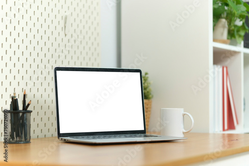 Wallpaper Mural Home office desk with computer laptop, coffee cup and houseplant on wood table. Torontodigital.ca